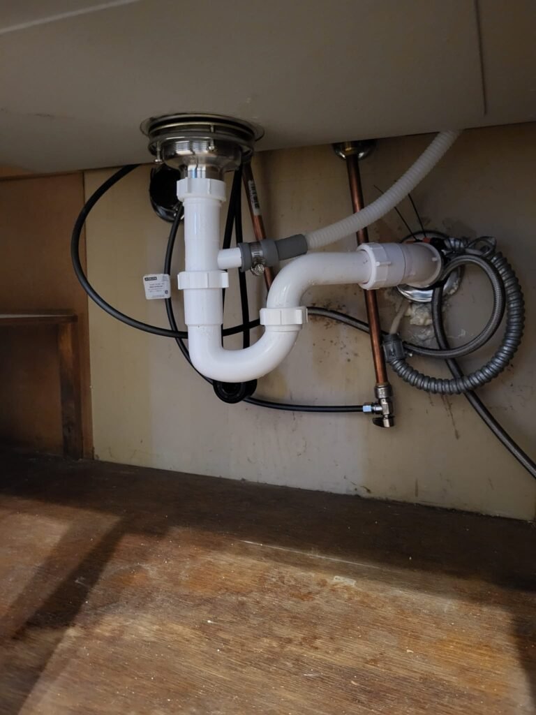 Homepage tuckers under a sink