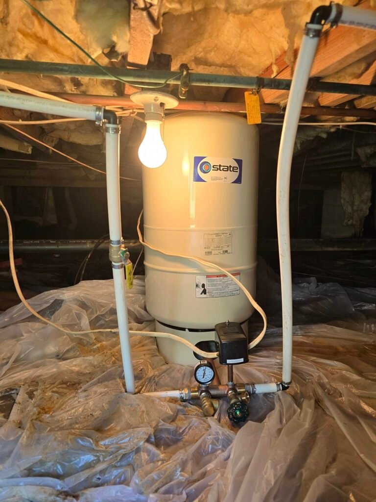 Water heater pressure tank under house
